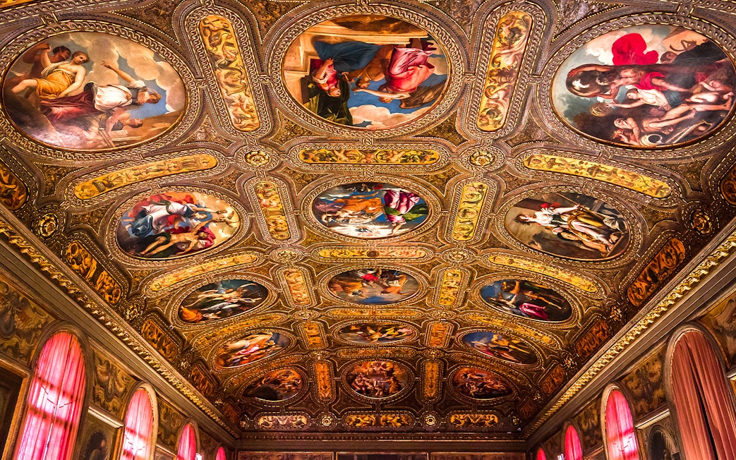 Ceiling frescoes and ornate details in Biblioteca Marciana, Venice, Italy.