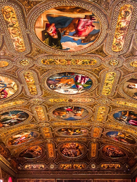 Ceiling frescoes and ornate details in Biblioteca Marciana, Venice, Italy.