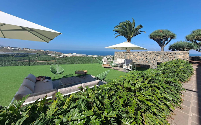 Gran Canaria Banana World terrace with ocean view and seating area.