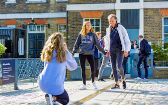 Guests standing on the Prime Meridian line at Royal Observatory Greenwich.