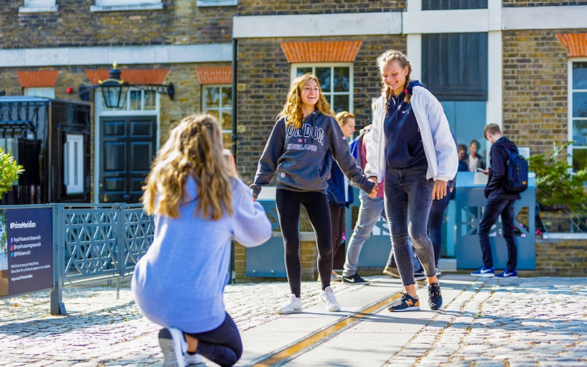 Guests standing on the Prime Meridian line at Royal Observatory Greenwich.