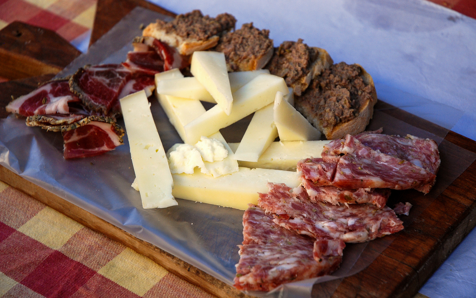 Cheese and cured meats platter on a Florence street food tour.