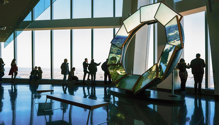 Visitors enjoying panoramic views at One World Observatory, New York City.