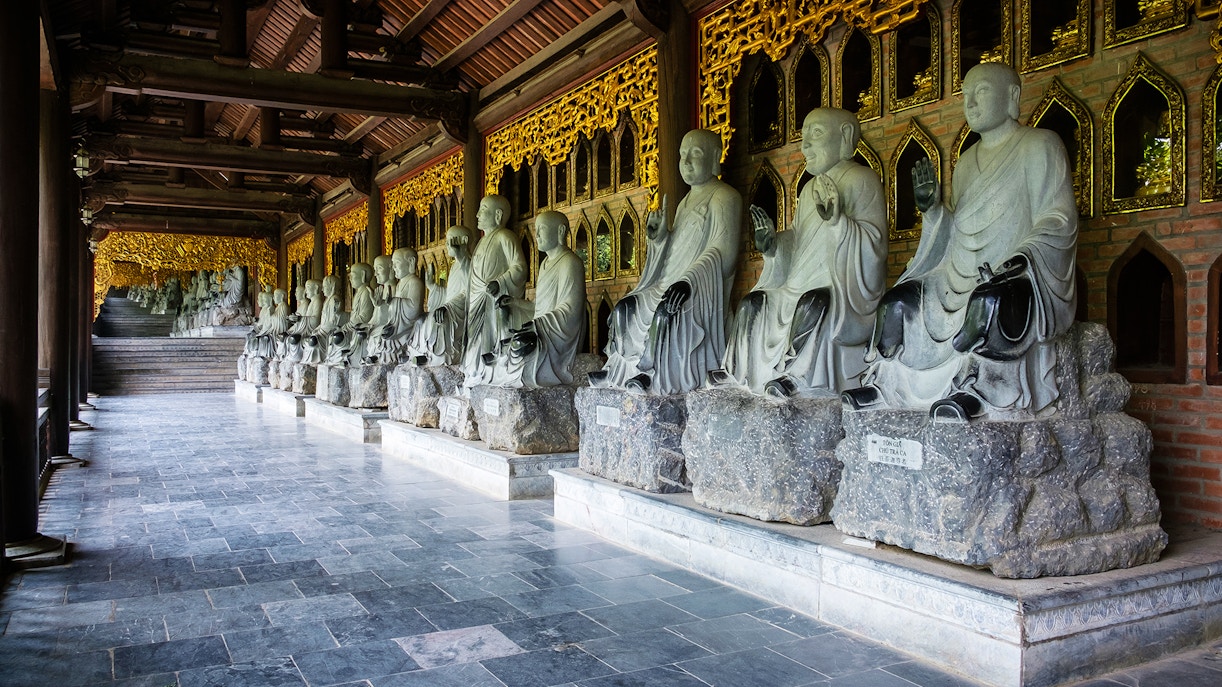Arhat statues lined up at New Bai Dinh Pagoda complex, Ninh Binh, Vietnam.