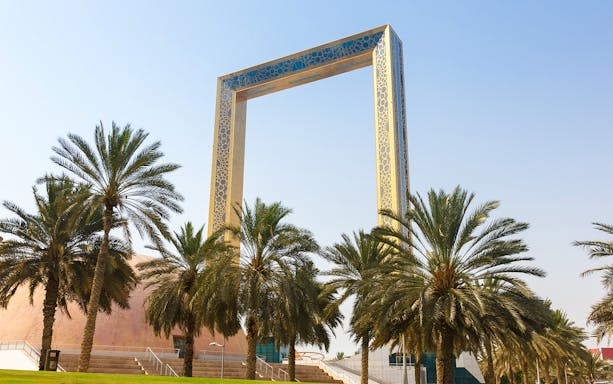 Dubai Frame with palm trees in United Arab Emirates.