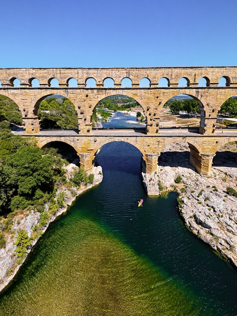 Pont du Gard aqueduct over river in Provence, France, seen on a guided tour from Avignon.