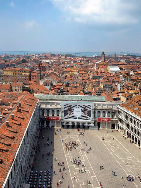Aerial view of St. Mark's Square and Venice rooftops from St. Mark's Bell Tower.