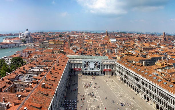 Aerial view of St. Mark's Square and Venice rooftops from St. Mark's Bell Tower.
