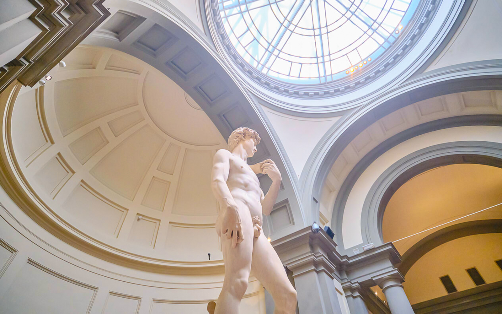 Michelangelo's David statue under dome at Accademia Gallery, Florence.
