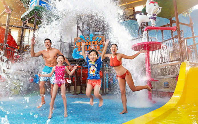 Family enjoying water splash at Whisker's Splash, Water World Ocean Park Hong Kong.