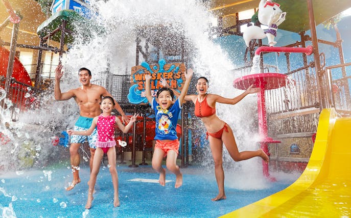 Family enjoying water splash at Whisker's Splash, Water World Ocean Park Hong Kong.