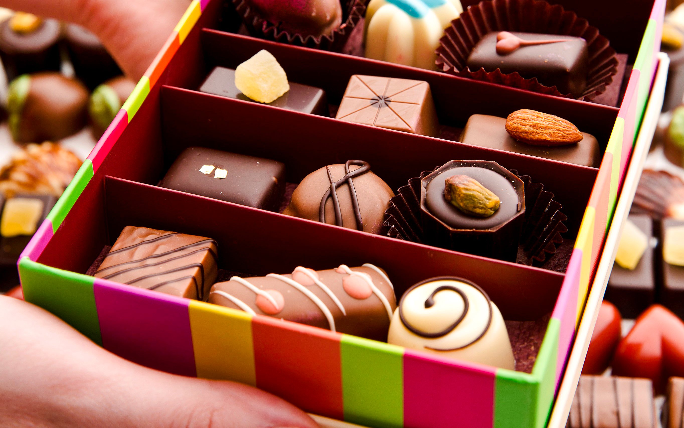 Assorted chocolates in a colorful box at Yarra Valley Chocolaterie Ice-Creamery.