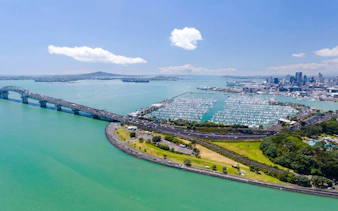 Auckland Waitematā Harbour with boats and city skyline in the background.