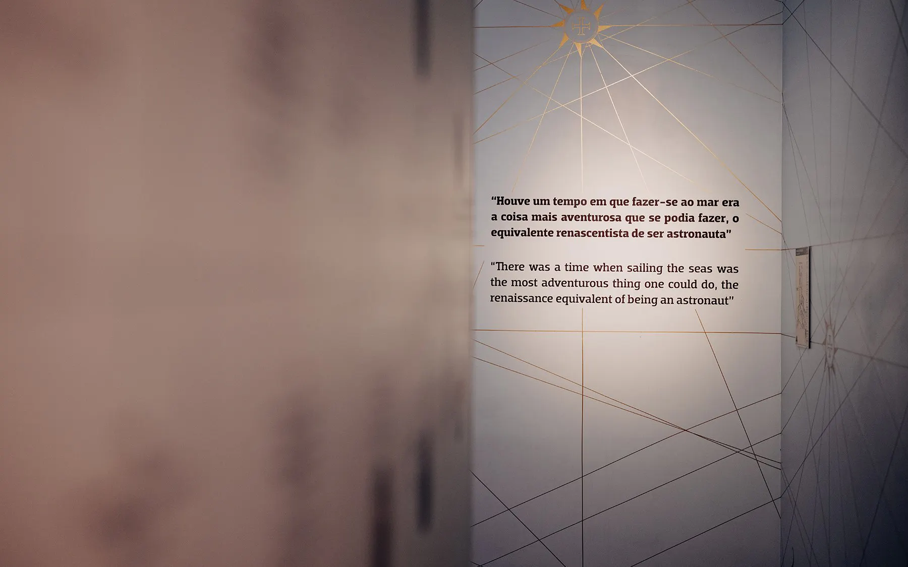 Quote on wall at World of Discoveries Interactive Digital Exhibition about the adventurous nature of sea exploration.