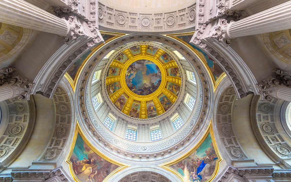 Dome interior of Napoleon's Tomb at the Paris Army Museum, featuring ornate frescoes.