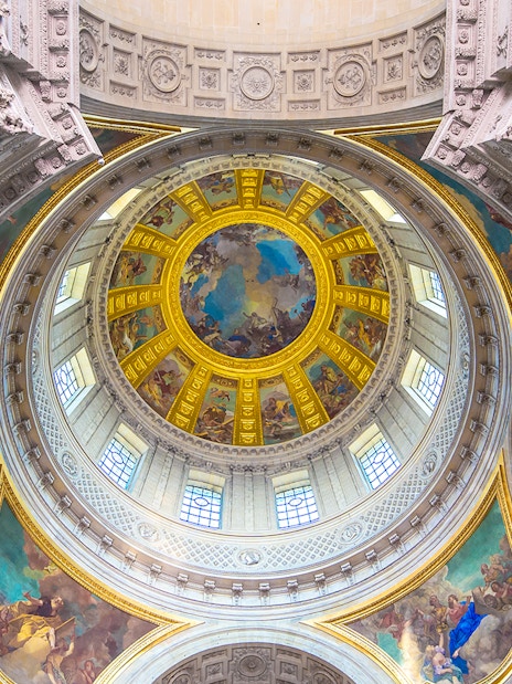 Dome interior of Napoleon's Tomb at the Paris Army Museum, featuring ornate frescoes.