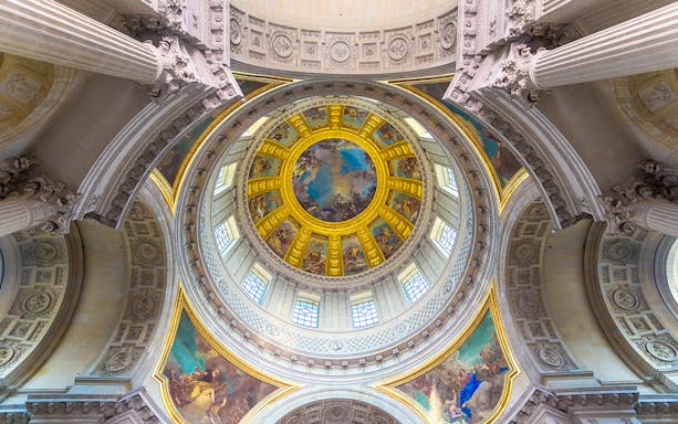 Dome interior of Napoleon's Tomb at the Paris Army Museum, featuring ornate frescoes.