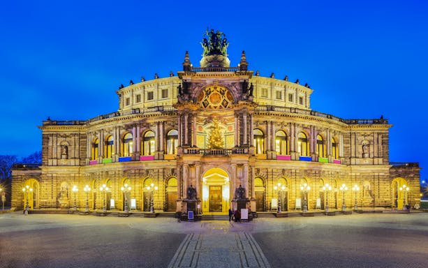 Semper Opera House illuminated at night, Dresden guided tour location.