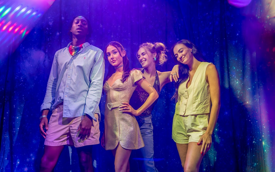 Arianna Grande wax figure with visitors at Madame Tussauds London.