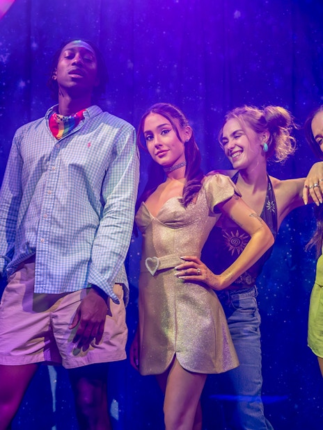 Arianna Grande wax figure with visitors at Madame Tussauds London.