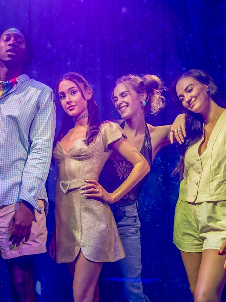 Arianna Grande wax figure with visitors at Madame Tussauds London.