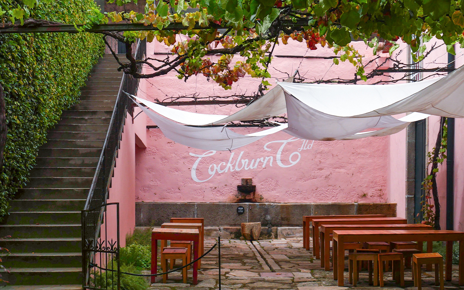 Courtyard at Cockburn's with tables set for English tour and Super Premium tasting.