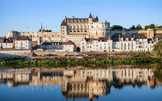 Royal Amboise Castle with reflection in the Loire River, France.