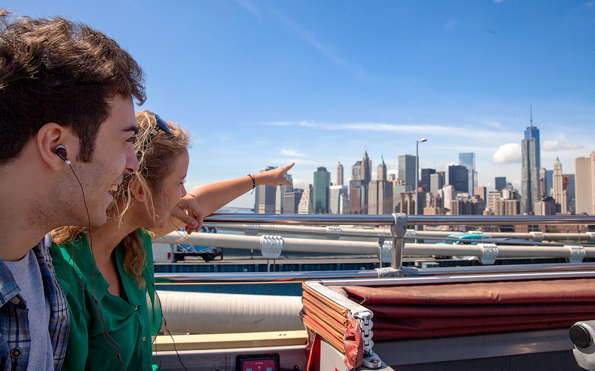 Passengers on Big Bus New York tour viewing Manhattan skyline.
