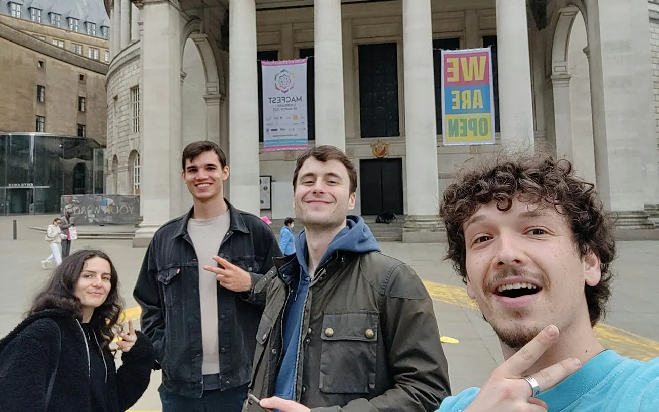 Group of friends outside Manchester Central Library during self-guided city exploration game.