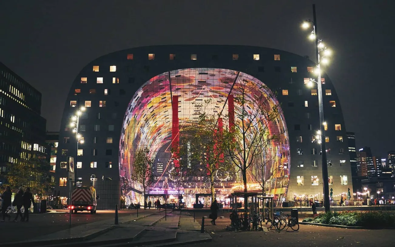 Markthal Rotterdam illuminated at night during Spy Hunt city exploration game.