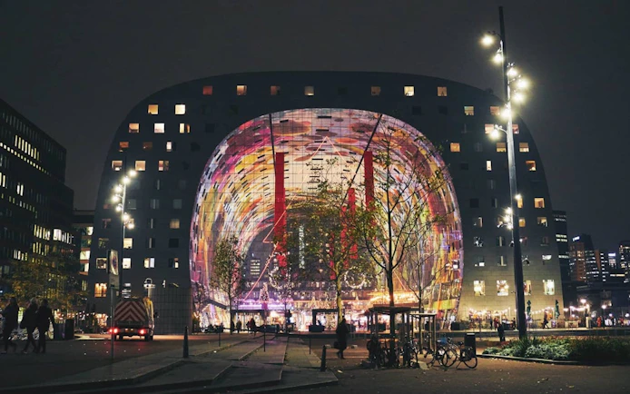 Markthal Rotterdam illuminated at night during Spy Hunt city exploration game.