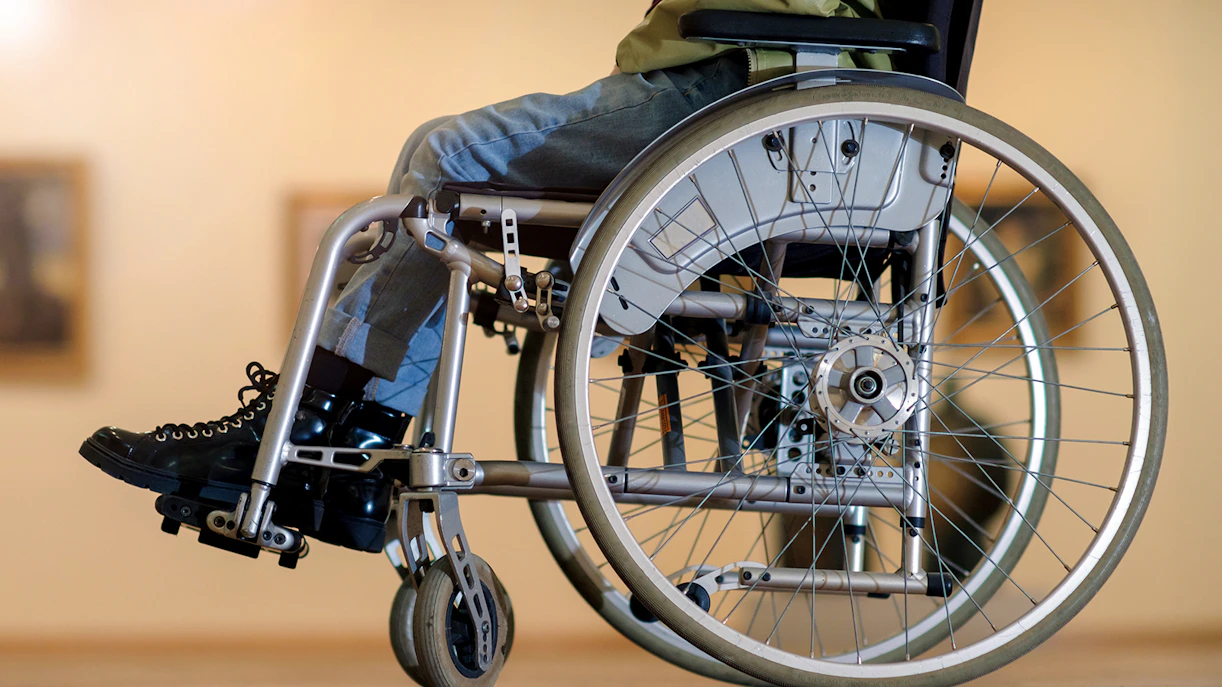 Wheelchair in a museum setting highlighting accessibility features.