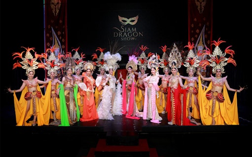 Performers in vibrant costumes at Siam Dragon Cabaret Show, Thailand.