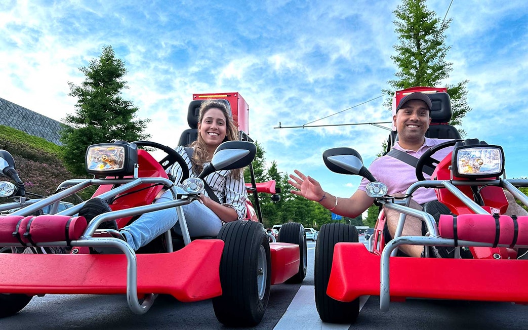 Tourists driving go-karts on the street in Akihabara, Tokyo.