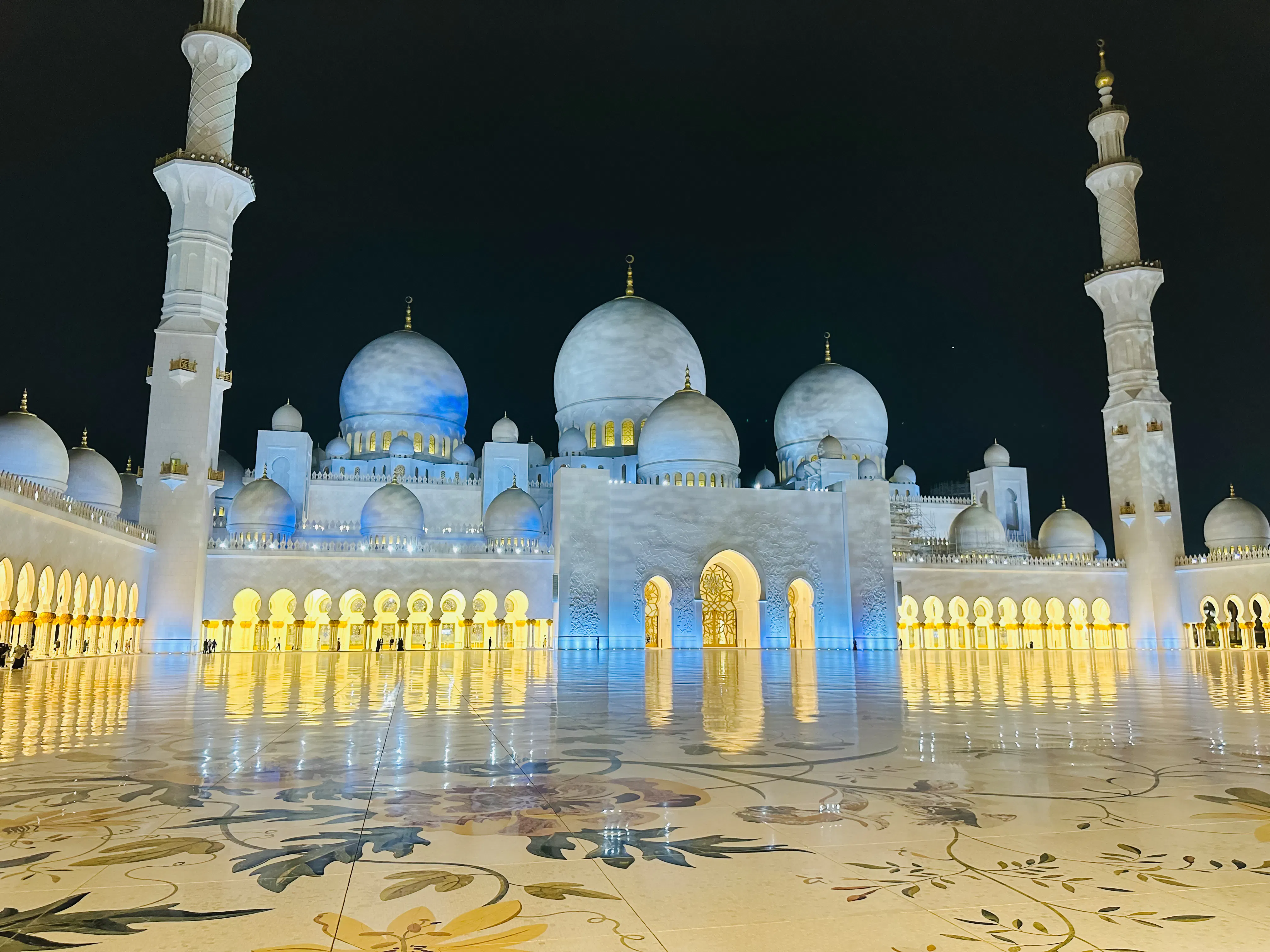 Sheikh Zayed Grand Mosque illuminated at night, Abu Dhabi city tour.