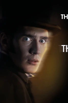 Theater poster for "The Woman in Black" in London featuring a man's face and title text.