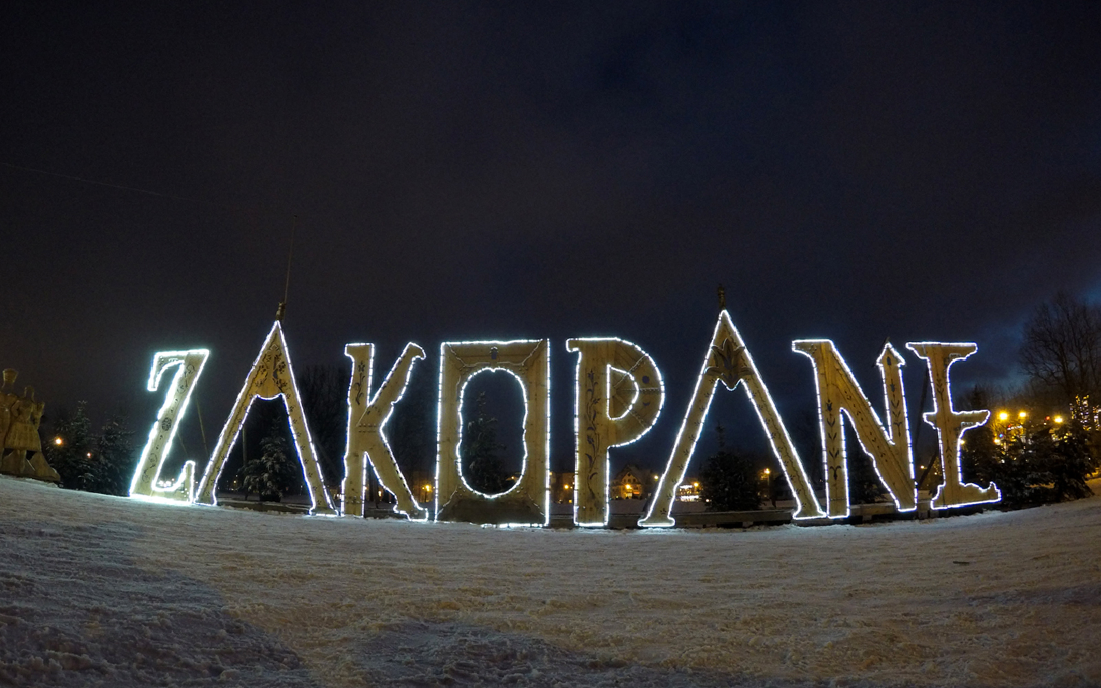 Zakopane illuminated sign at night during a tour from Krakow.