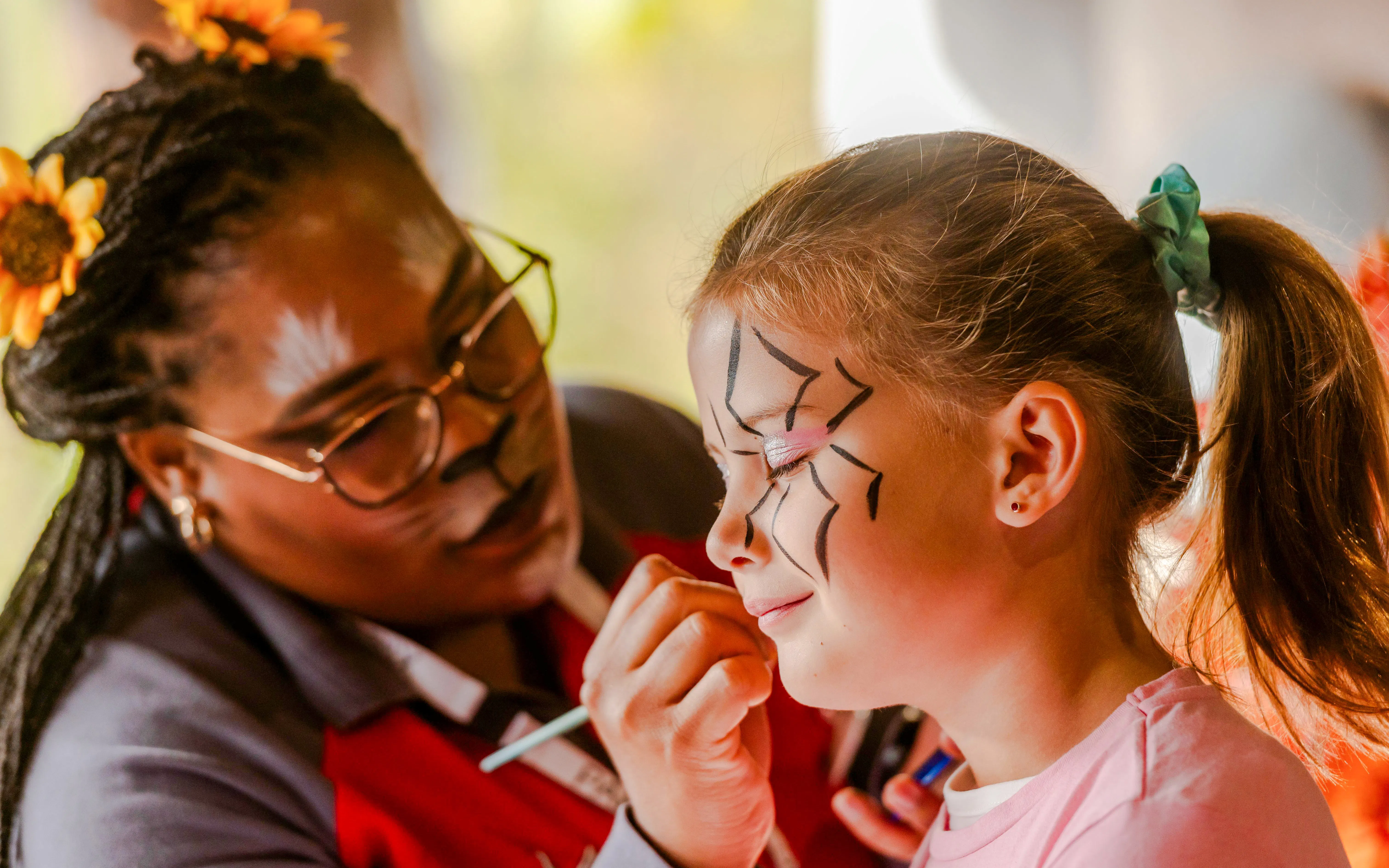 Face painting at Parc Asterix Halloween event in Paris, France.