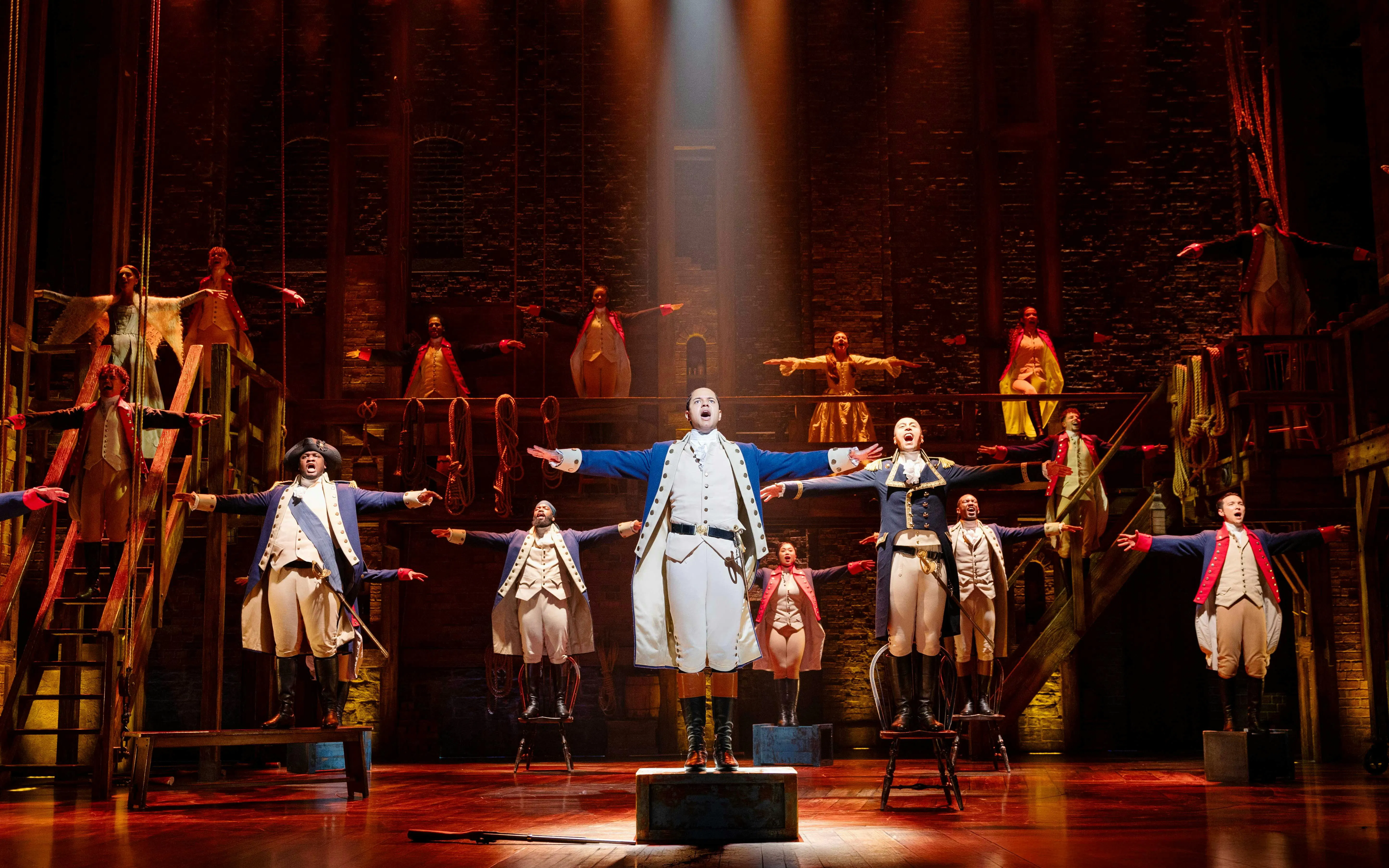 Hamilton cast performing on stage, West End production.