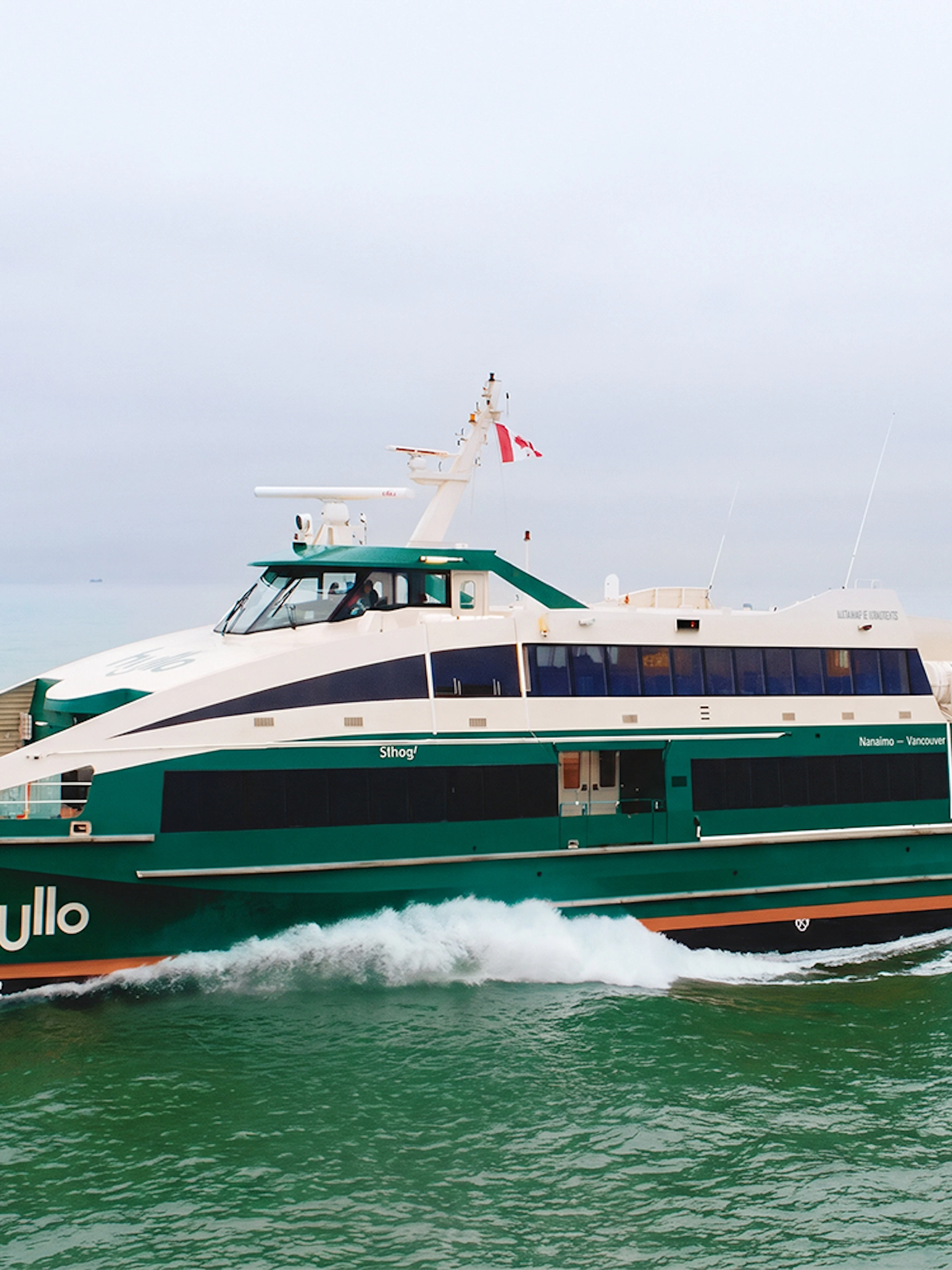 Ferry sailing in Canadian waters with a Canadian flag.