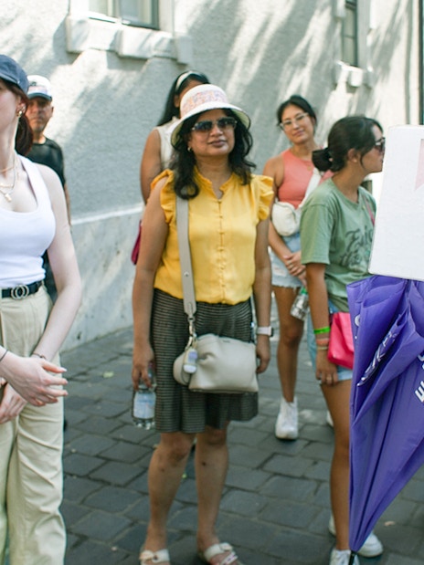 Tour guide showing Dobos Torta image to group during St. Stephen's Basilica tour.