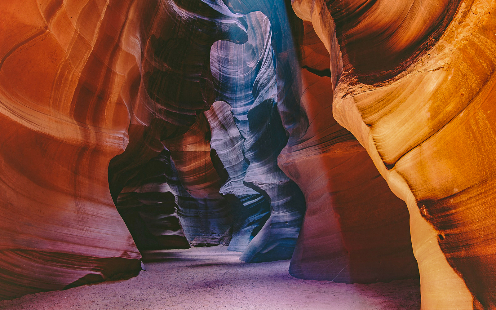 Upper Antelope Canyon's swirling sandstone walls in vibrant colors.