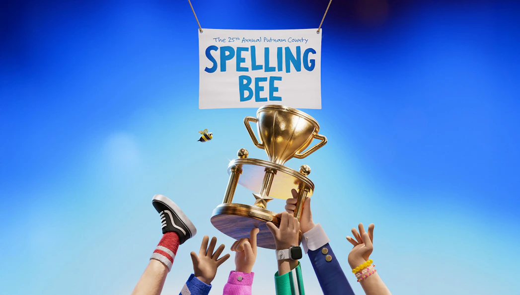 Hands holding a trophy under a sign for The 25th Annual Putnam County Spelling Bee.