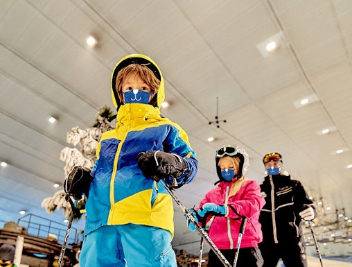 Children skiing indoors at Ski Dubai, UAE.