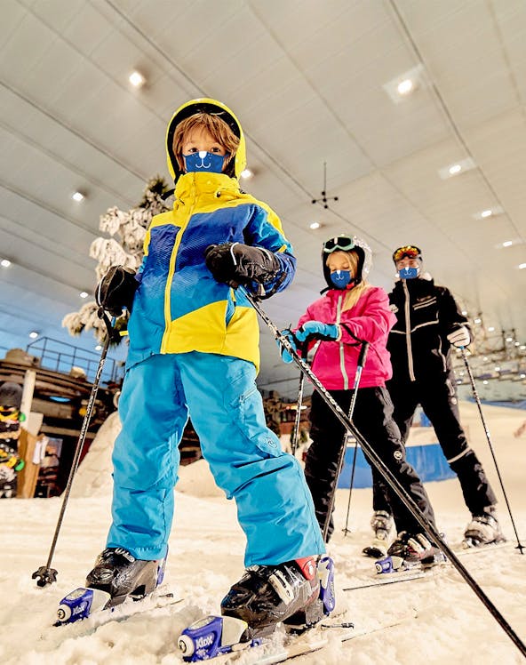 Children skiing indoors at Ski Dubai, UAE.