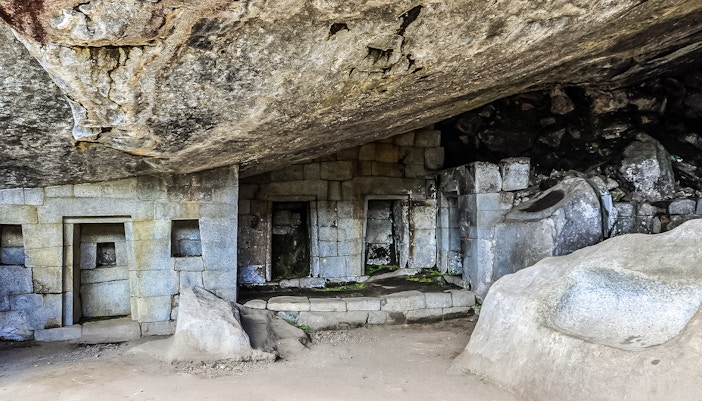 Great Cave stone structures at Machu Picchu, Peru.