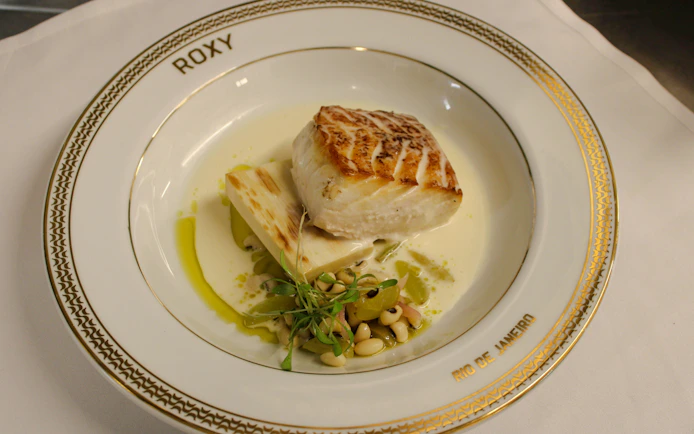 Grilled fish with vegetables on a Roxy plate, Rio de Janeiro dinner show.