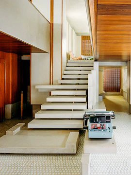 Interior of Negozio Olivetti in Venice with modern staircase and vintage typewriter.