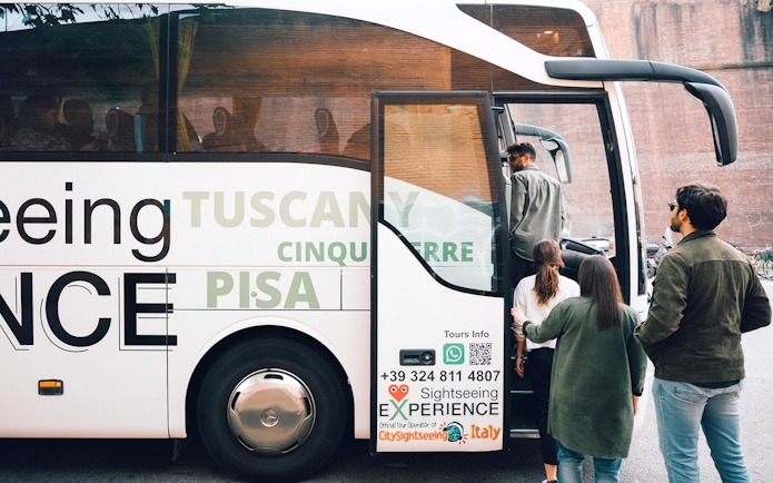 Tourists boarding a bus for Cinque Terre from Florence.