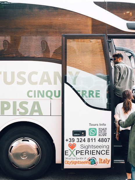 Tourists boarding a bus for Cinque Terre from Florence.